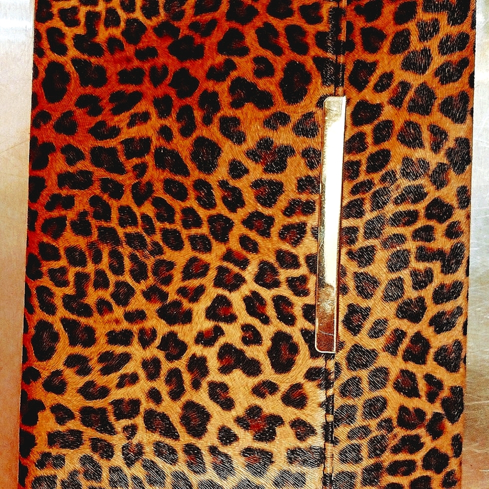 Leopard clutch with gold strap.